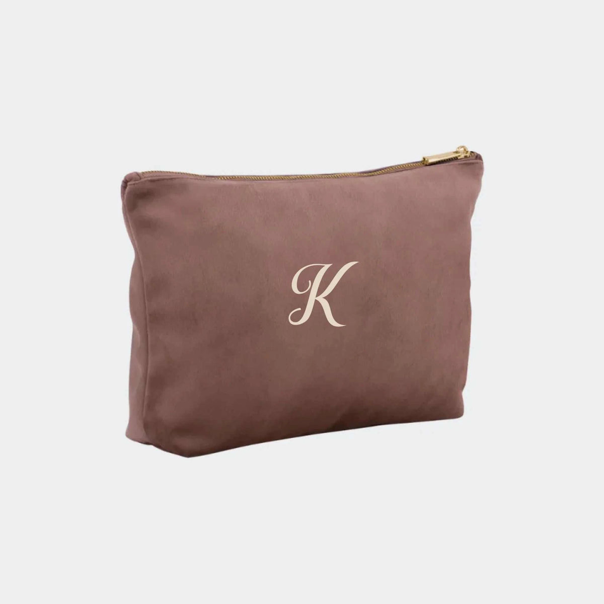 Lille rosefarvet accessorytaske i velour med broderet bogstav