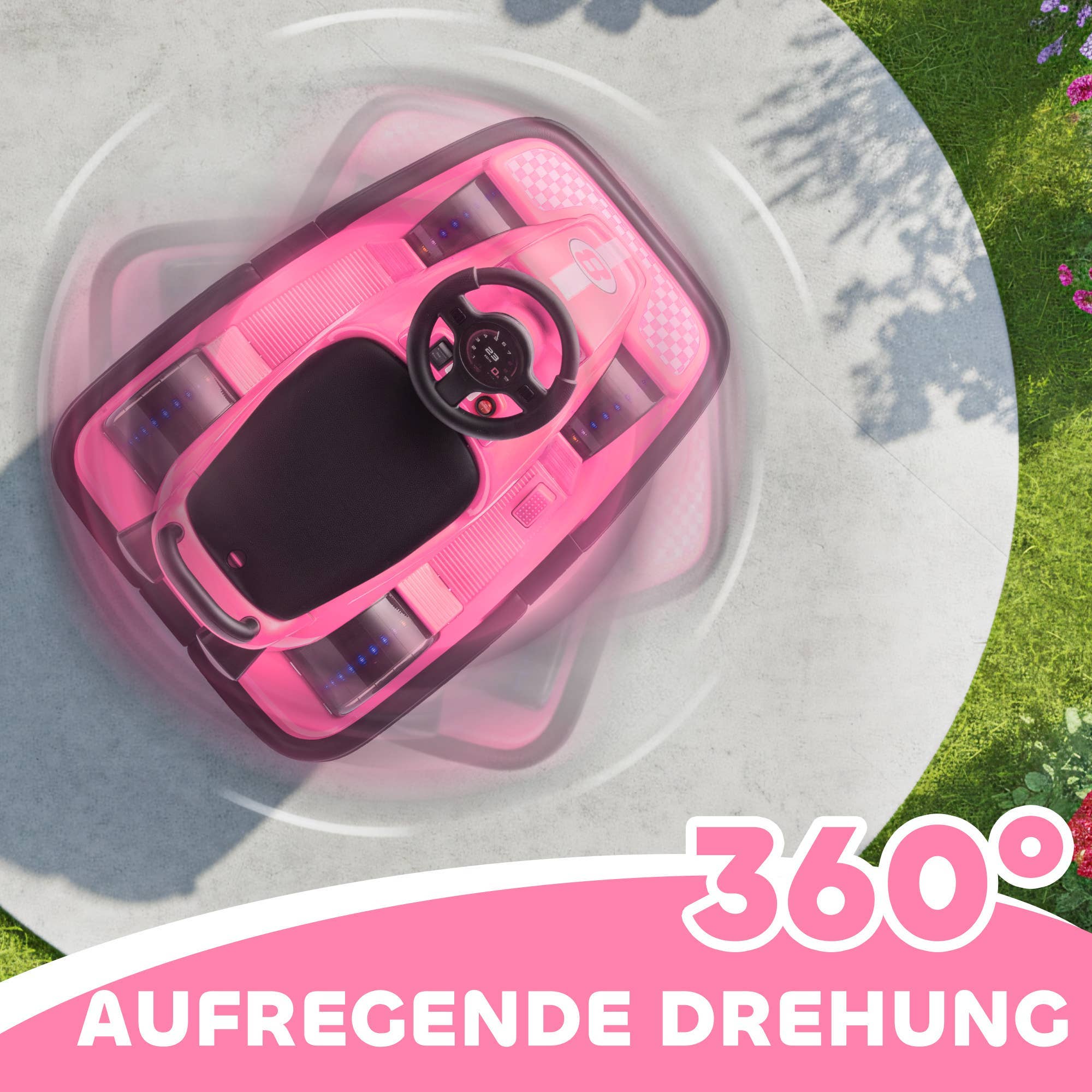 Rosa bumperbil til børn set fra oven, der demonstrerer 360 graders drejefunktion udendørs.
