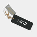 Sort/Guld nøglering - MOR Customizer 123Unik Sort/Guld nøglering - Egen tekst sort 3.5 x 9cm