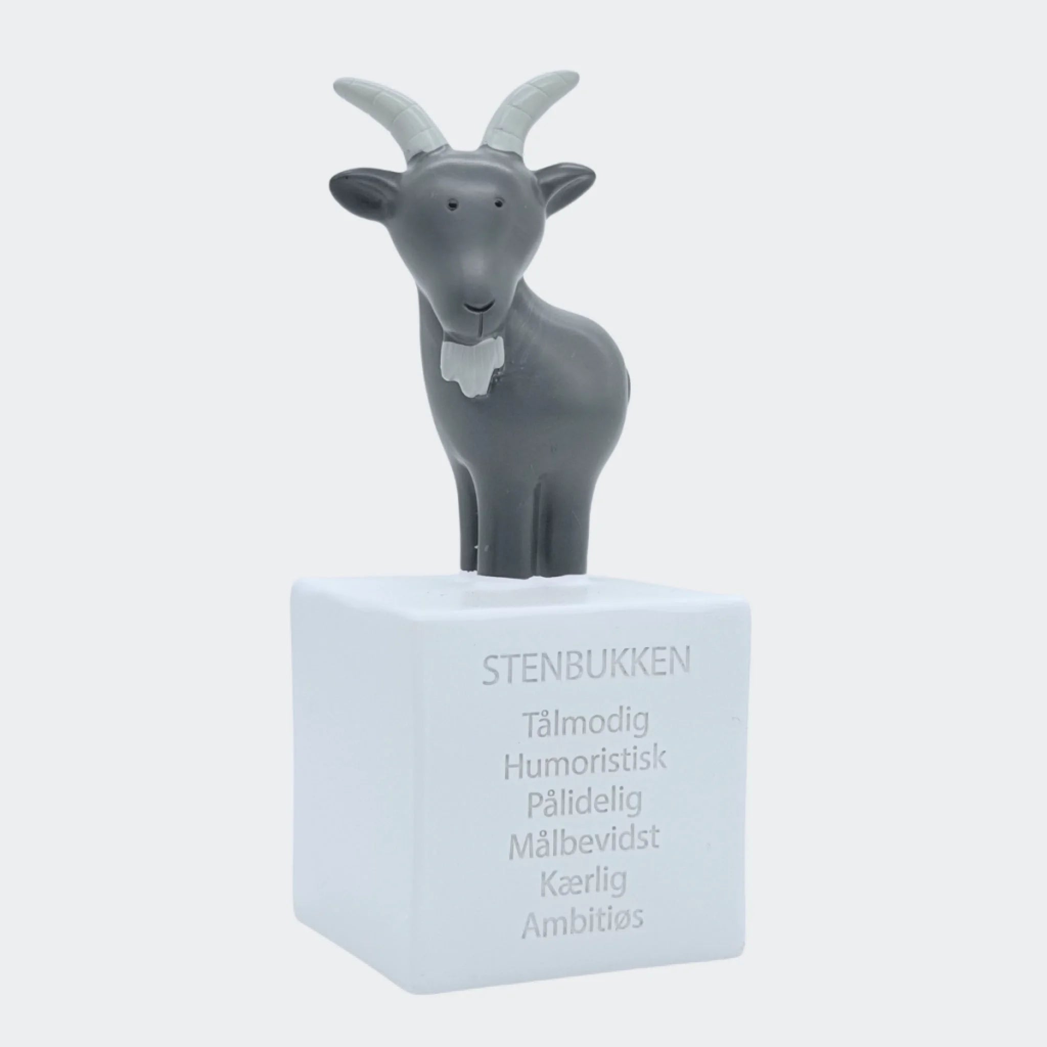 Forsiden af Stenbukken-sparebøssen med en stenbuk og stjernetegnstekst