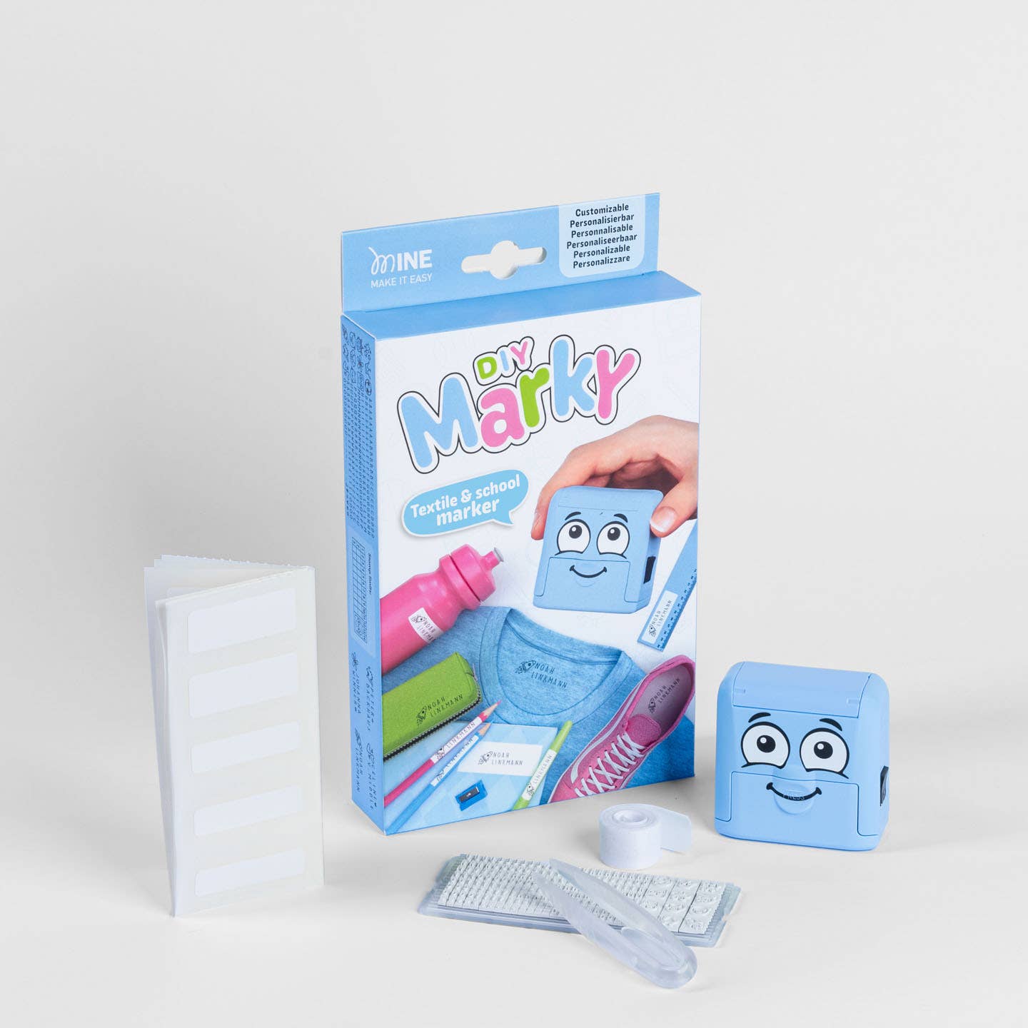 Tekstilstempel til mærkning med blåt stempel med tilbehør og pakke